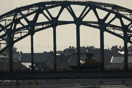 Silhouette of Train on Industrial Bridge