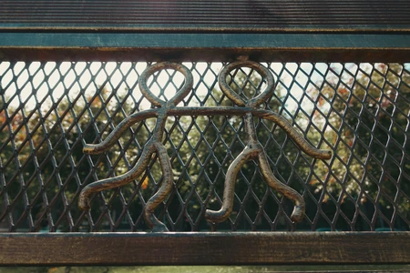 Metal Figures on Fence