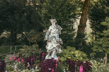 Garden Statue Amidst Lush Greenery