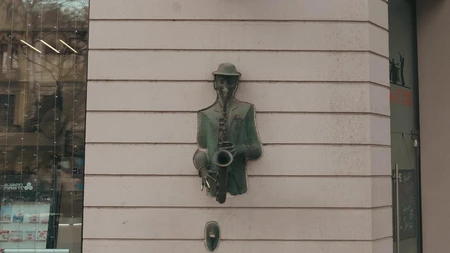 Saxophonist Sculpture on Building