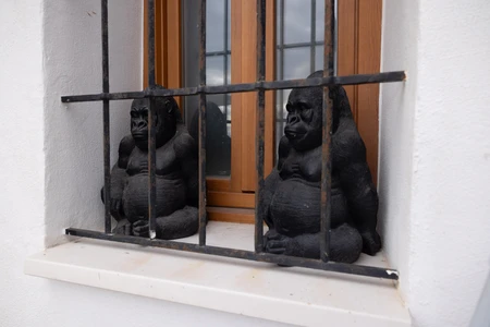 Gorilla Statues Behind Bars