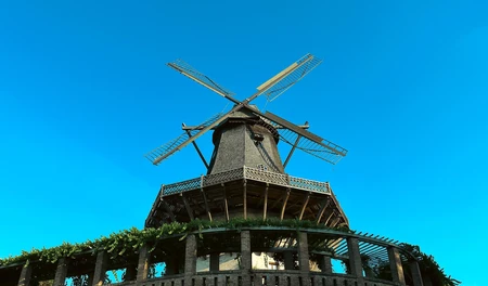 Historic Windmill Against Blue Sky