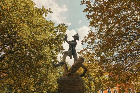 Statue in a Leafy Park