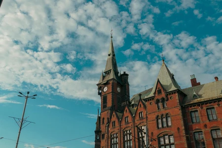 Historic Brick Building Under Blue Sky