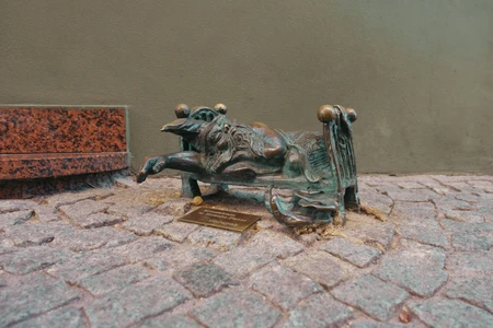Bronze Sculpture on Cobblestone Path