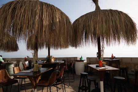 Beachfront Cafe with Straw Umbrellas