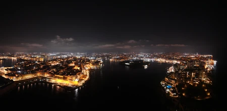 Illuminated Coastal Cityscape at Night