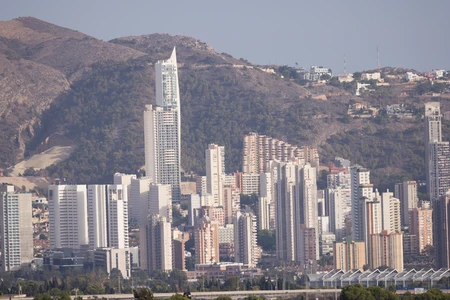 Modern Cityscape Against Mountain