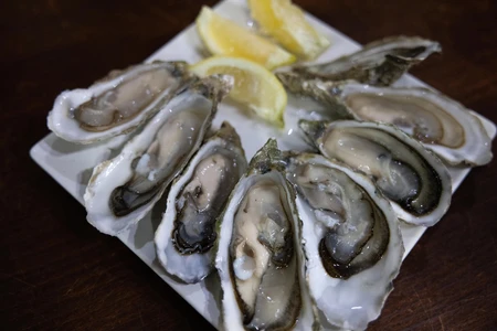Fresh Oysters and Lemon Wedges