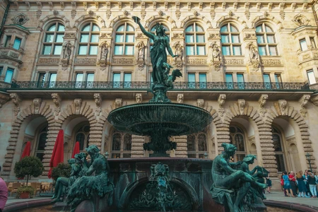 Historic Fountain in Front of Ornate Building