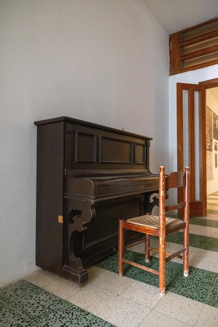 Antique Piano in Hallway
