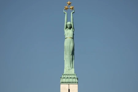Statue with Stars against Blue Sky