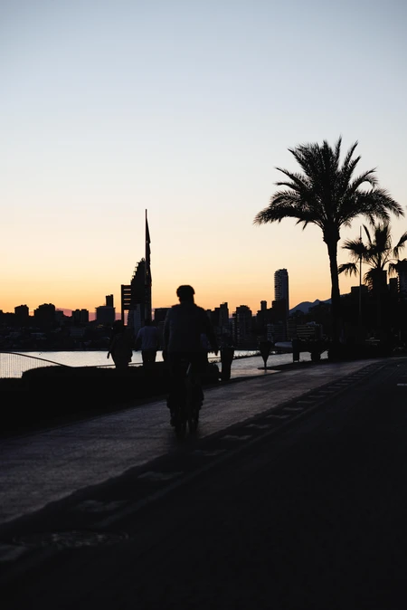 Sunset Cityscape with Cyclist