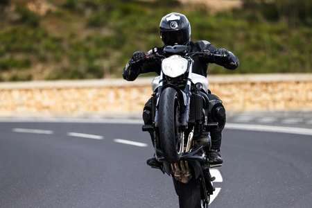 Motorcycle Stunt on Open Road