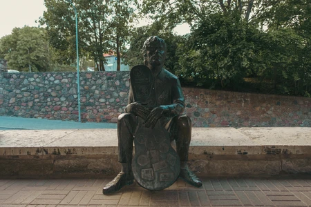 Bronze Statue on a Bench