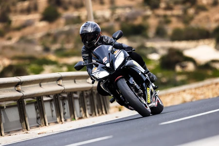 Motorcyclist on a Curvy Road