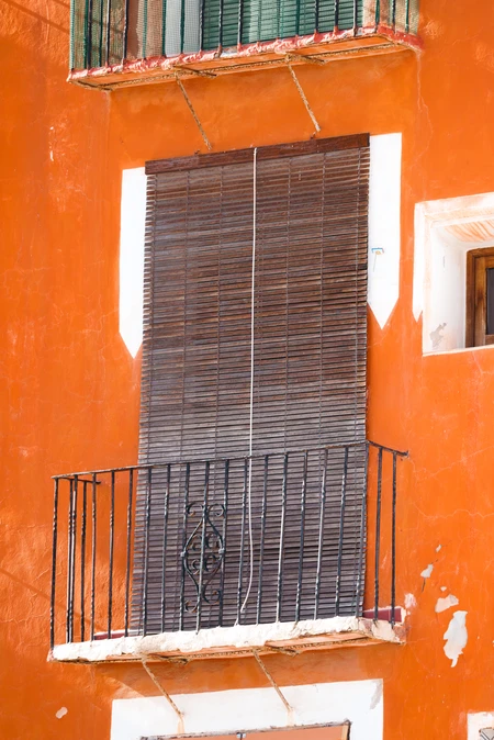 Sunlit Balcony with Shuttered Window