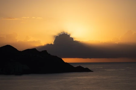 Sunset Over Mountain Silhouette