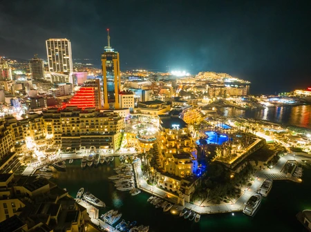 Vibrant Night View of a Coastal Cityscape