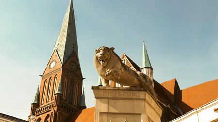 Historic City Architecture with Lion Sculpture