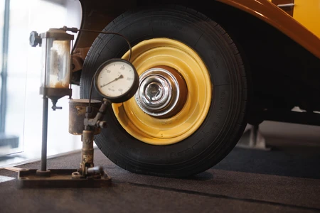 Vintage Car Wheel and Gauge