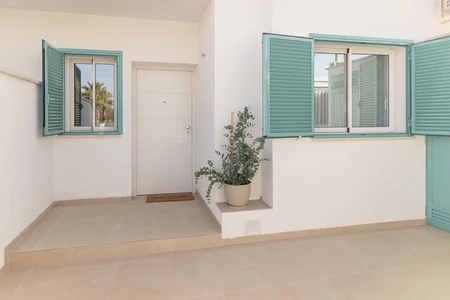 Modern Exterior with Turquoise Shutters