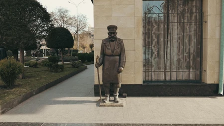 Statue by a Building