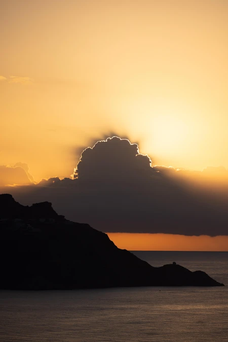 Sunset Over Silhouetted Hills