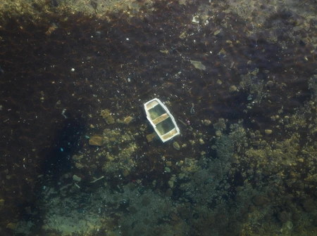 Sunken Boat in Shallow Waters