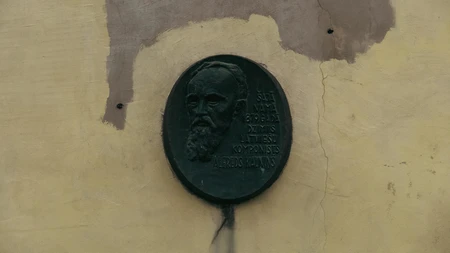 Historic Plaque on Weathered Wall