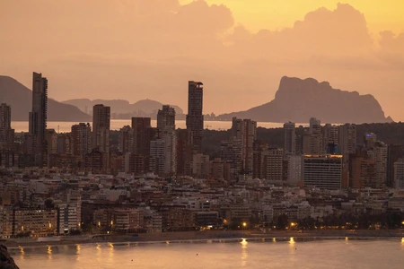 Sunset Over a Coastal City Skyline