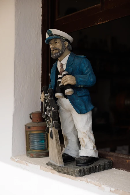 Sailor Figurine by the Window