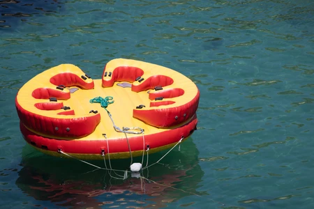 Colorful Water Raft on Clear Blue Water