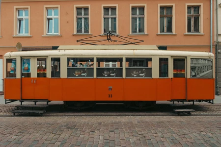 Vintage Tram on Cobbled Street
