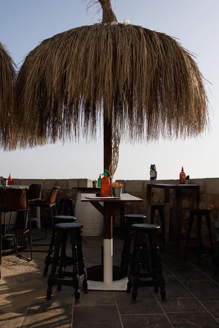 Beachside Lounge with Straw Umbrella