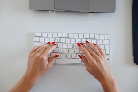 Hands Typing on Keyboard