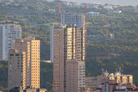 Urban Skyline with Hillside Background
