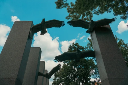 Monumental Eagles Against Blue Sky