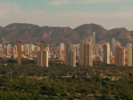 Cityscape with Mountain Backdrop