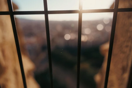 Blurred City View Through Bars