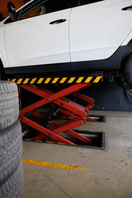 Car on Lift in Workshop