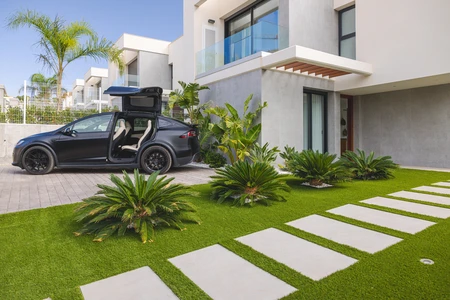 Modern Home with Electric Car