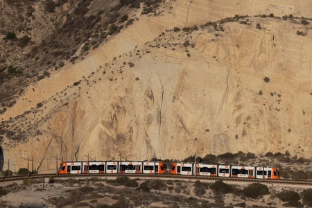Train Passing Through Rocky Landscape