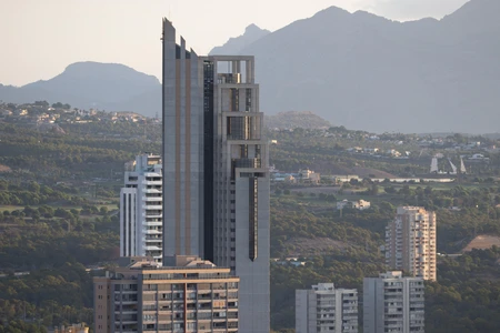 Skyscraper Amidst Mountains