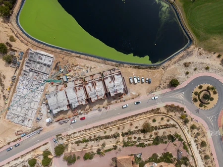 Aerial View of Construction Site by a Lake