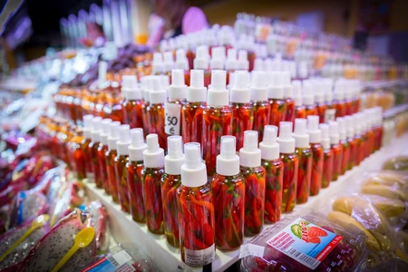 Market Display of Bottled Peppers