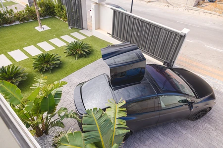 Modern Home with Electric Car