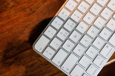 Minimalist Keyboard on Wooden Surface