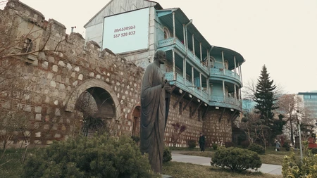 Historic Stone Building with Statue