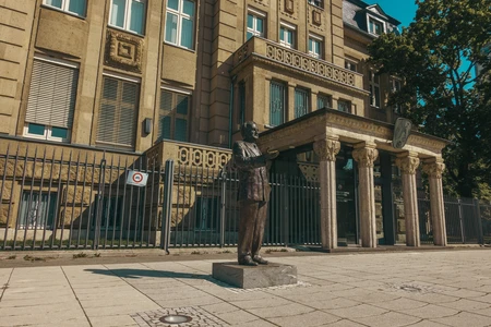 Statue in Front of Historical Building